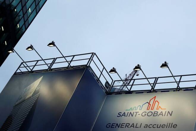 The logo of Saint-Gobain is seen on a banner on a building construction site in the financial and business district of La Defense, outside Paris