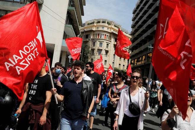 Protesters take part in a rally commemorating May Day in Athens