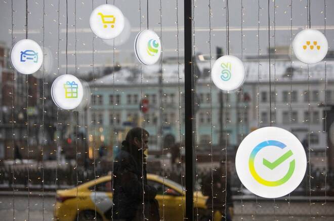 A man walks past an office of the Russian largest lender Sberbank in Moscow