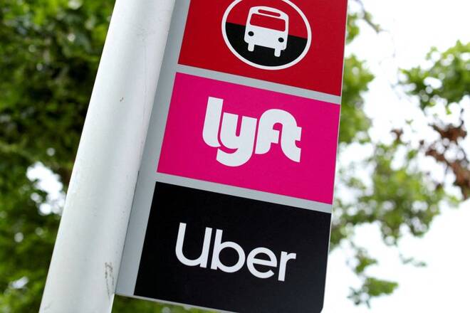 The logos of Lyft and Uber are displayed