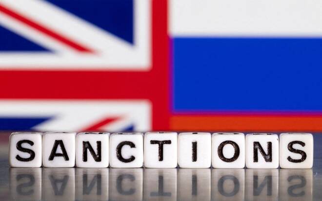 Illustration shows letters arranged to read "Sanctions" in front of Union Jack and Russian flag colors
