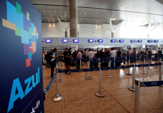 People queue at Brazil's airline Azul check-in at Viracopos airport in Campinas