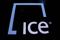 A screen displays the ticker symbol and logo for Intercontinental Exchange Inc. (ICE) on the floor of the New York Stock Exchange