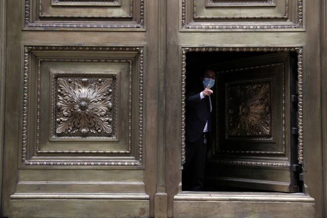 A security worker gestures while closing the door of the Chilean Central Bank building in downtown Santiago