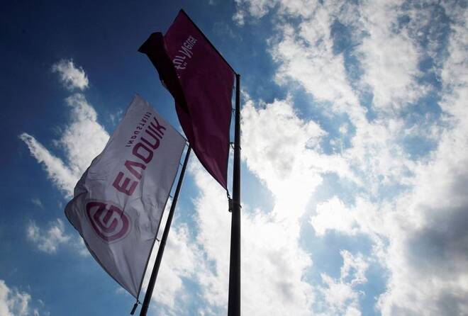 Flags of the specialty chemical manufacturer Evonik Industries flutter in the wind at a factory in Darmstadt