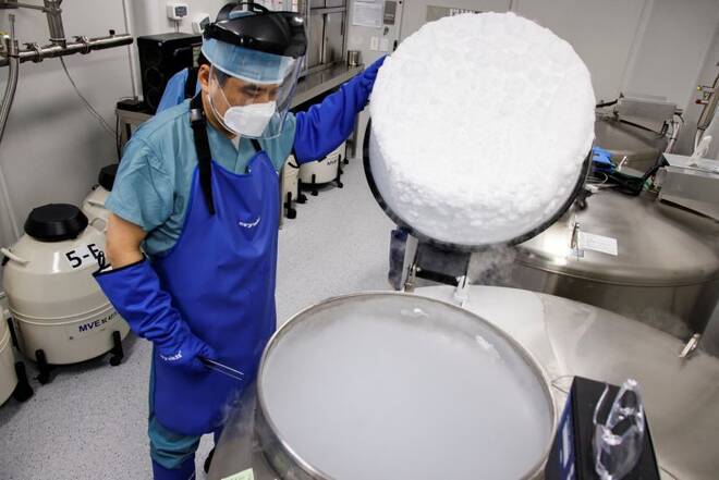 An employee checks a bio tank that freezes eggs in a Fertility Research lab at Cha Fertility Center in Bundang