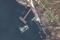 A satellite image shows a closer view of a barge, a Serna-class landing craft and a sunken Serna craft in Snake Island