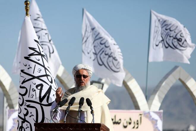 Afghan Deputy Prime Minister Mawlavi Abdul Salam Hanafi speaks during a ceremony to raise the Taliban flag