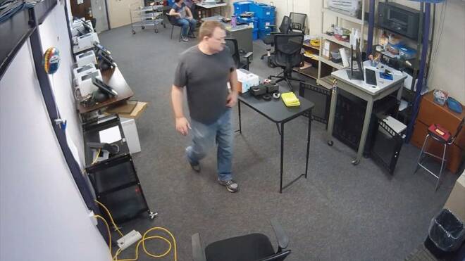 Clerk Dallas Schroeder is seen in surveillance footage inside his office in Elbert County
