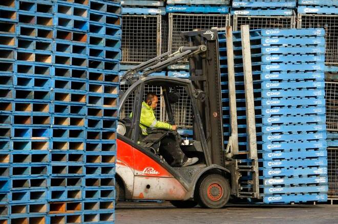 Forklift operator moves stack of pallets at Brambles-owned CHEP pallet depot in Sydney