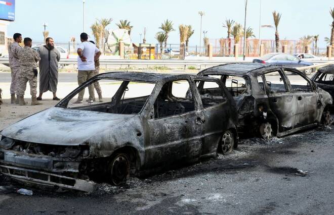 Vehicles destroyed after fighting between soldiers loyal to the head of Libya's Government of National Unity, Abdulhamid al-Dbeibah, and rival forces, are seen in Tripoli