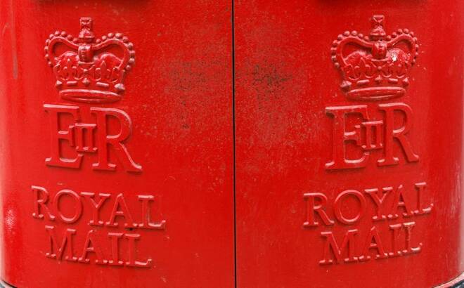 A Royal Mail sign is pictured on a post box outside a Post Office, in St Albans
