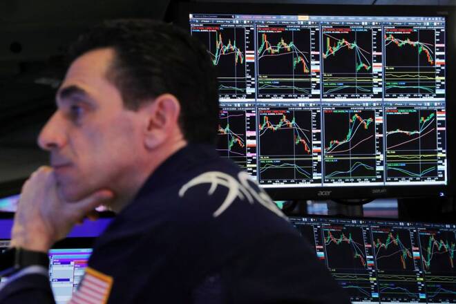 A trader at the New York Stock Exchange works as markets continue to react to the coronavirus disease (COVID-19) inside of the NYSE in New York