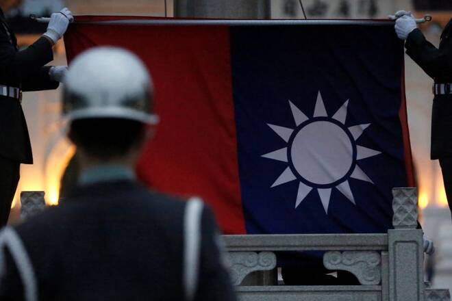 Honor guards perform Taiwan national flag lowering ceremony at Liberty Square in Taipei,