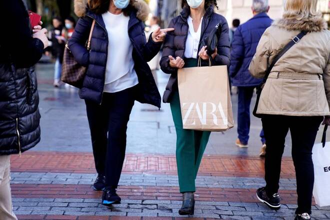 A shopper carries bags from Zara clothes store in Bilbao