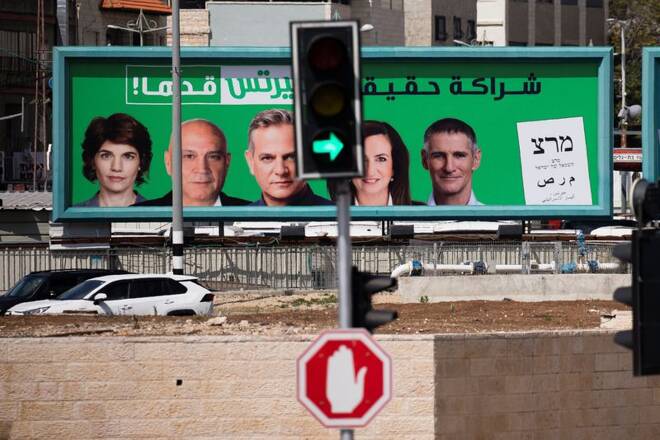 A "Meretz" party election campaign banner is seen behind traffic lights ahead of the March 23 ballot in the northern Israeli-Arab city of Nazareth