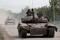 Tanks of pro-Russian troops drive along a street in Popasna