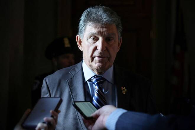 Senator Joe Manchin (D-WV) speaks to journalists in the United States Capitol building in Washington