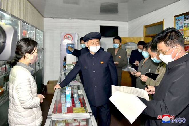 North Korea's Premier Kim Tok Hun, inspects a pharmacy amid the coronavirus disease (COVID-19) pandemic, in Pyongyang