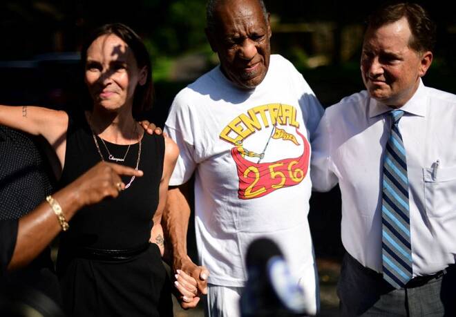 Bill Cosby is welcomed outside his home after Pennsylvania's highest court overturned his sexual assault conviction and ordered him released from prison immediately, in Elkins Park