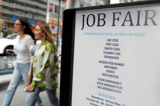 Signage for a job fair is seen on 5th Avenue in Manhattan, New York City