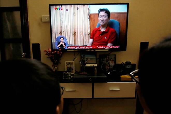 An image of Vietnamese former oil executive Trinh Xuan Thanh is seen on a TV screen on state-run television VTV, saying he turns himself in at a police station in Hanoi