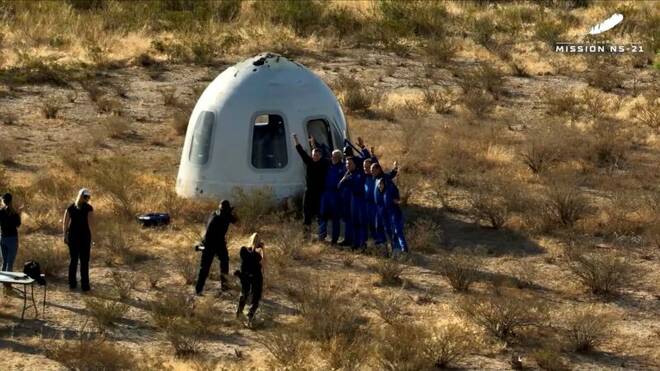 The occupants of Blue Origin's fifth crewed capsule mission pose for photographs after landing near Van Horn