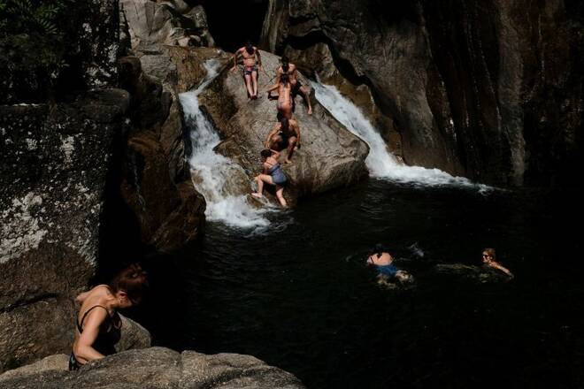 People swim in the Cavado River at the Peneda-Geres National Park near Braga
