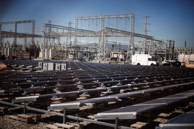 Solar panels are seen next to a Southern California Edison electricity station in Carson