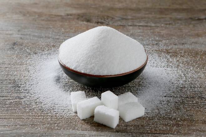 Granulated sugar and sugar cubes are seen in this picture illustration