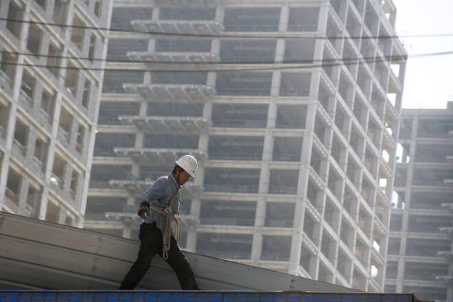 A man works at the construction site of a new financial district in Beijing