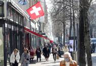Shoppers walk along the Bahnhofstrasse shopping street in Zurich