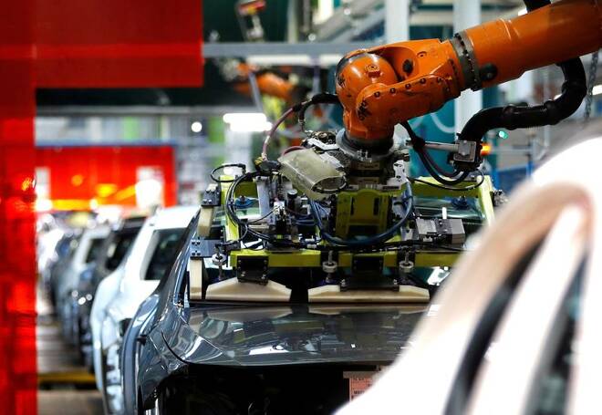 A robot adjusts a windscreen in a fully automated process on a model of the A-class production line of German car manufacturer Mercedes Benz at the Daimler factory in Rastatt
