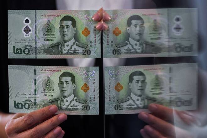 The new twenty baht polymer banknote is unveiled in Bangkok.