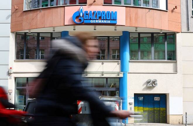 A cyclist passes the headquarters of Gazprom Germania in Berlin