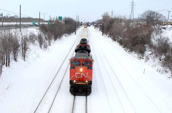 A Canadian National Railway train travels eastward on a track in Montreal