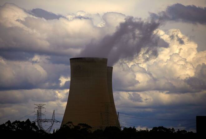 Storm clouds can be seen behind chimneys at the Bayswater coal-powered thermal power station located near the central New South Wales town of Muswellbrook, Australia