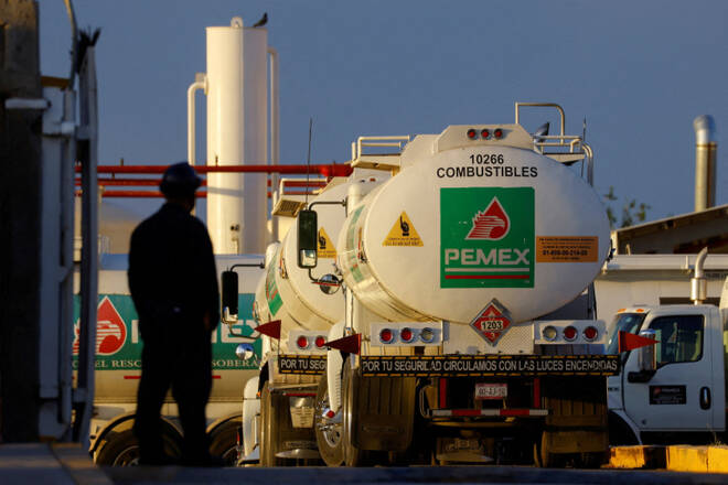 Worker stands near tanker truck at Petroleos Mexicanos (PEMEX) fuel storage and distribution center in Ciudad Juarez