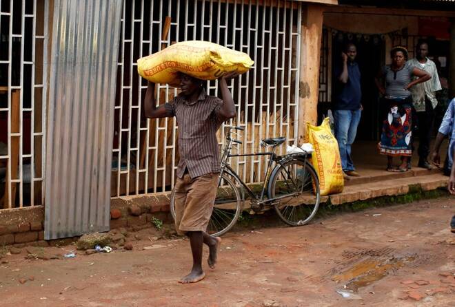 A Malawian subsistence farmer carries a bag of fertilizer near the capital Lilongwe