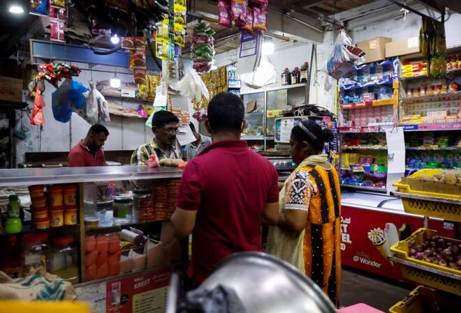 People shop at the grocery store amid the country's economic crisis, in Colombo