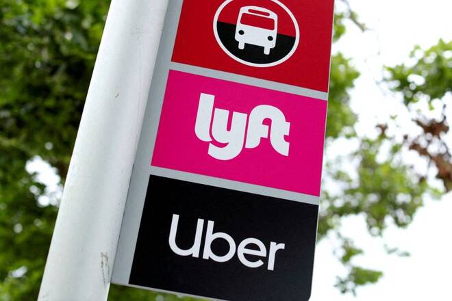 The logos of Lyft and Uber are displayed