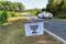 A sign planted by opponents of the Piedmont Lithium's planned mine is seen on a roadside in Gaston County