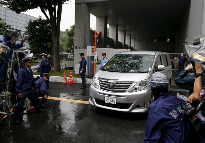 A car carrying former Toyota Motor Corp executive Hamp leaves Harajuku Police Station in Tokyo