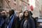 Tamara Lanier looks up as she walks with attorney Ben Crump after speaking to the media, outside of the Harvard Club in New York