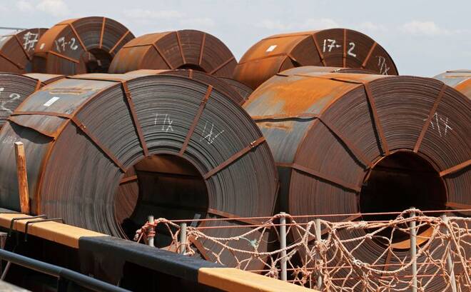 FILE PHOTO - A cargo ship is loaded with steel rolls at the Port of Mariupol