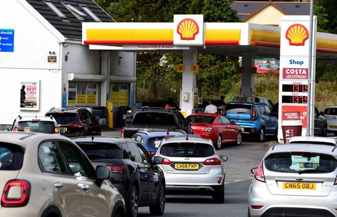 Cars queue up at a petrol and diesel filling station in Begelly
