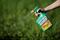 A woman uses a Monsanto's Roundup weedkiller spray without glyphosate in a garden in Ercuis near Paris