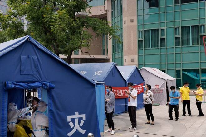 People line up at a nucleic acid testing station, following the coronavirus disease (COVID-19) outbreak, in Beijing