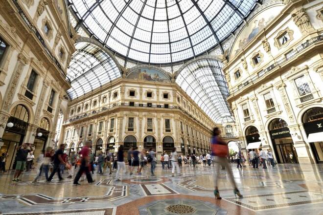 People walk along the Galleria Vittorio Emanuele II shopping mall in Milan