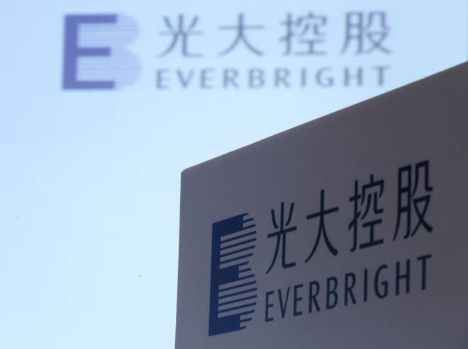 The company logo of China Everbright Limited are displayed at a news conference on the company's annual results in Hong Kong